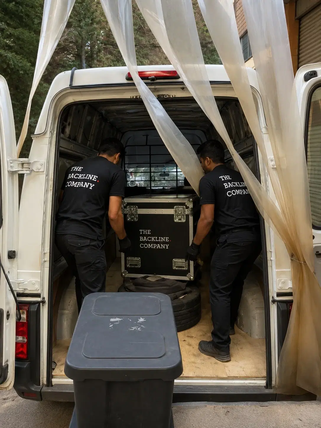 Loading the vehicle - Flight cases sequenced around safe movement and venue access