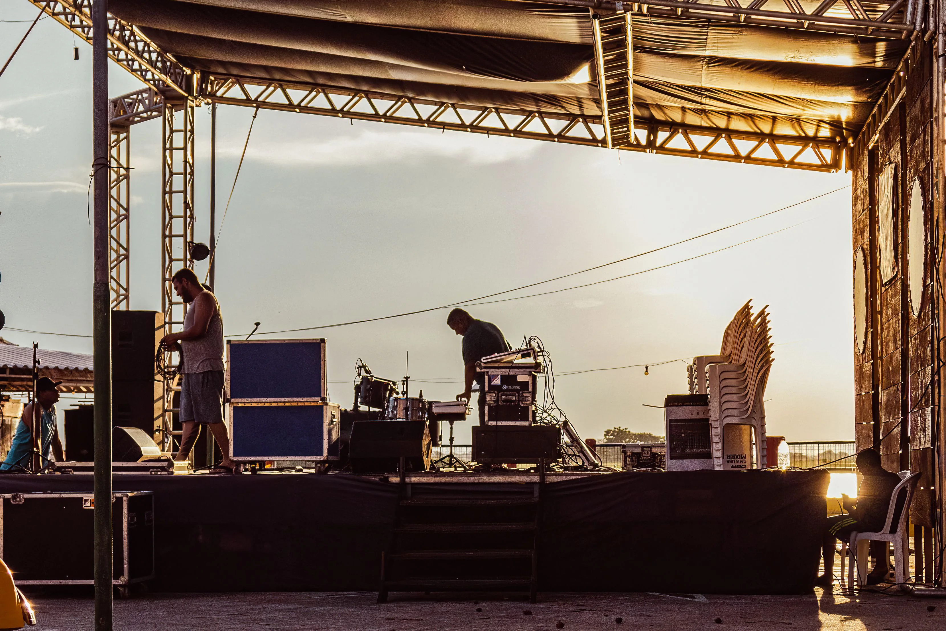 Professional concert backline equipment and flight cases organised during stage load-in planning