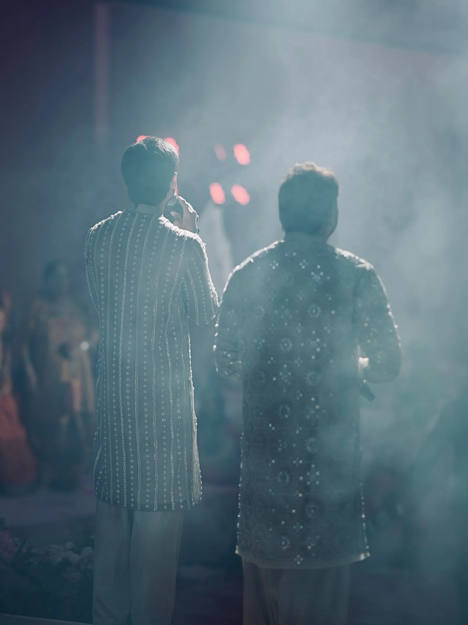 The two RSJ vocalists viewed from behind on stage