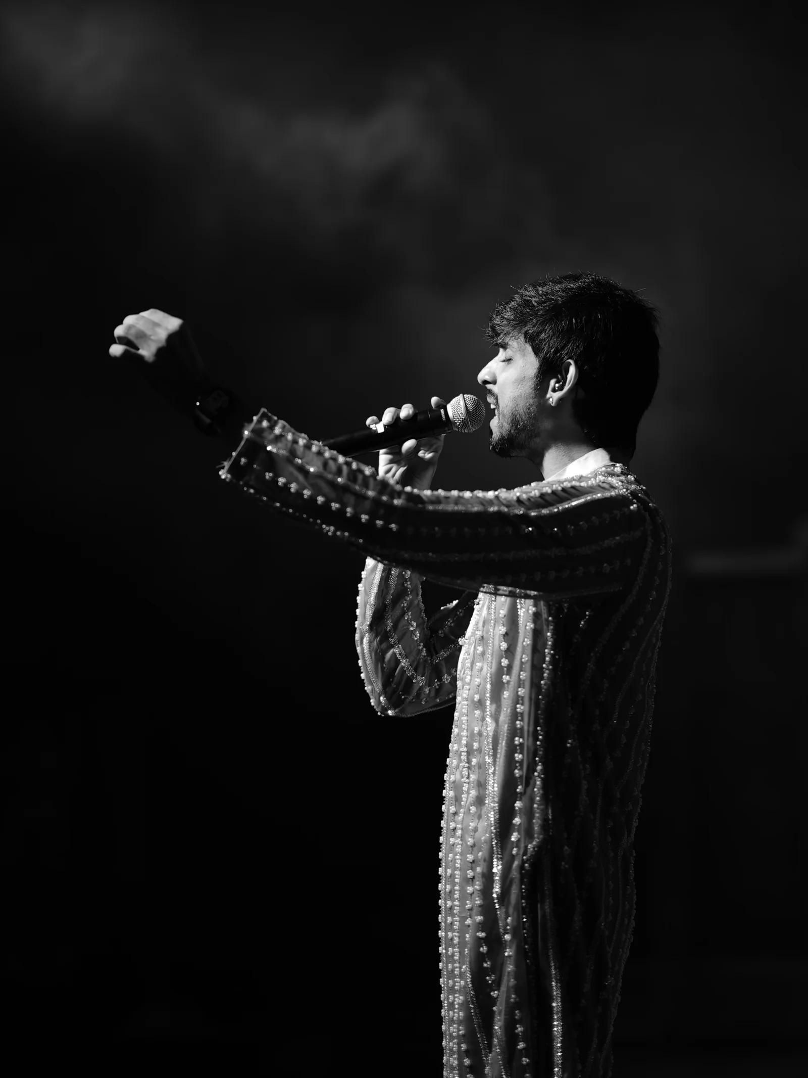 RSJ vocalist reaching toward the audience during the performance